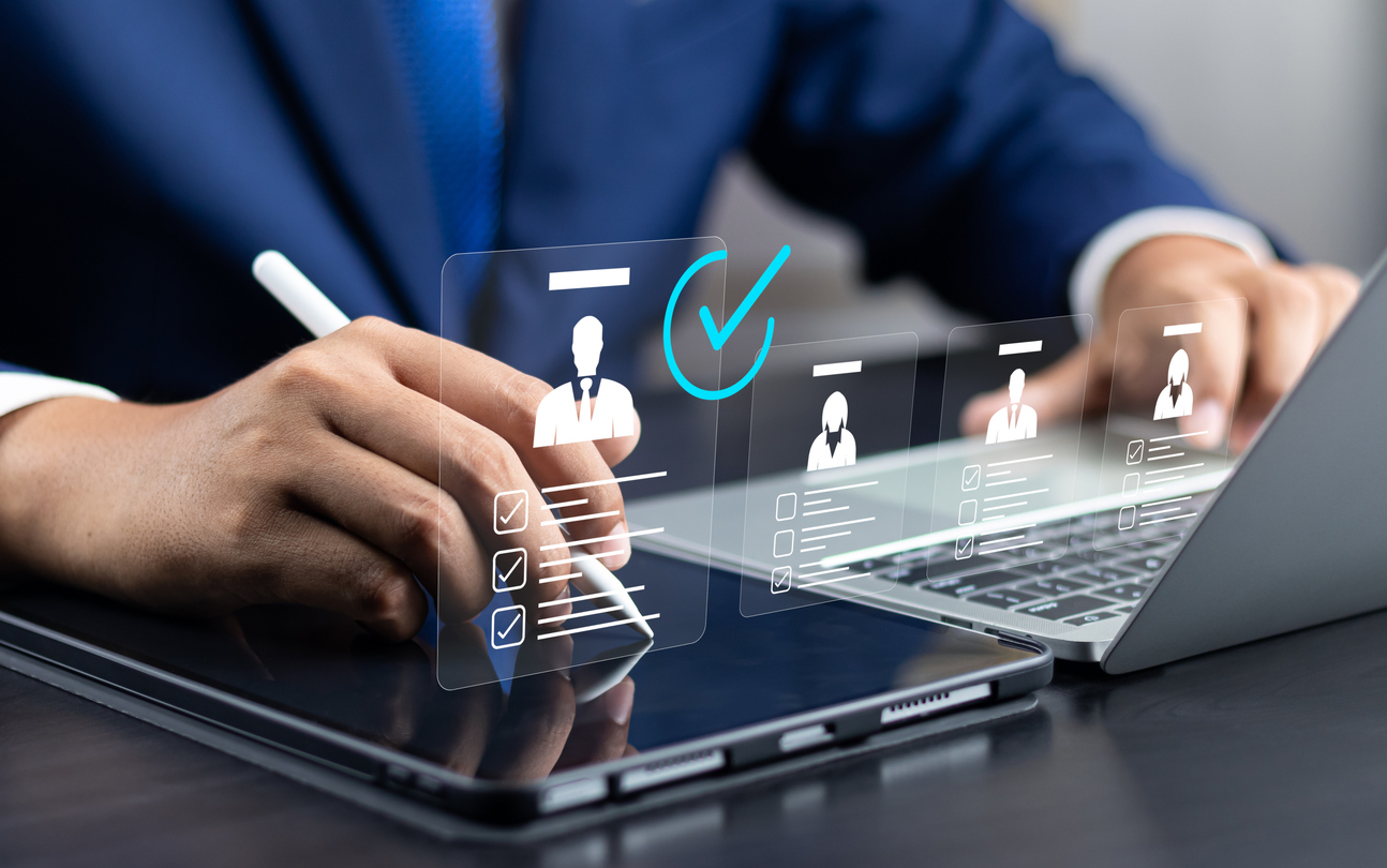 Human resource manager touching human resource network structure and checks the CV online to choose the perfect employee for company
